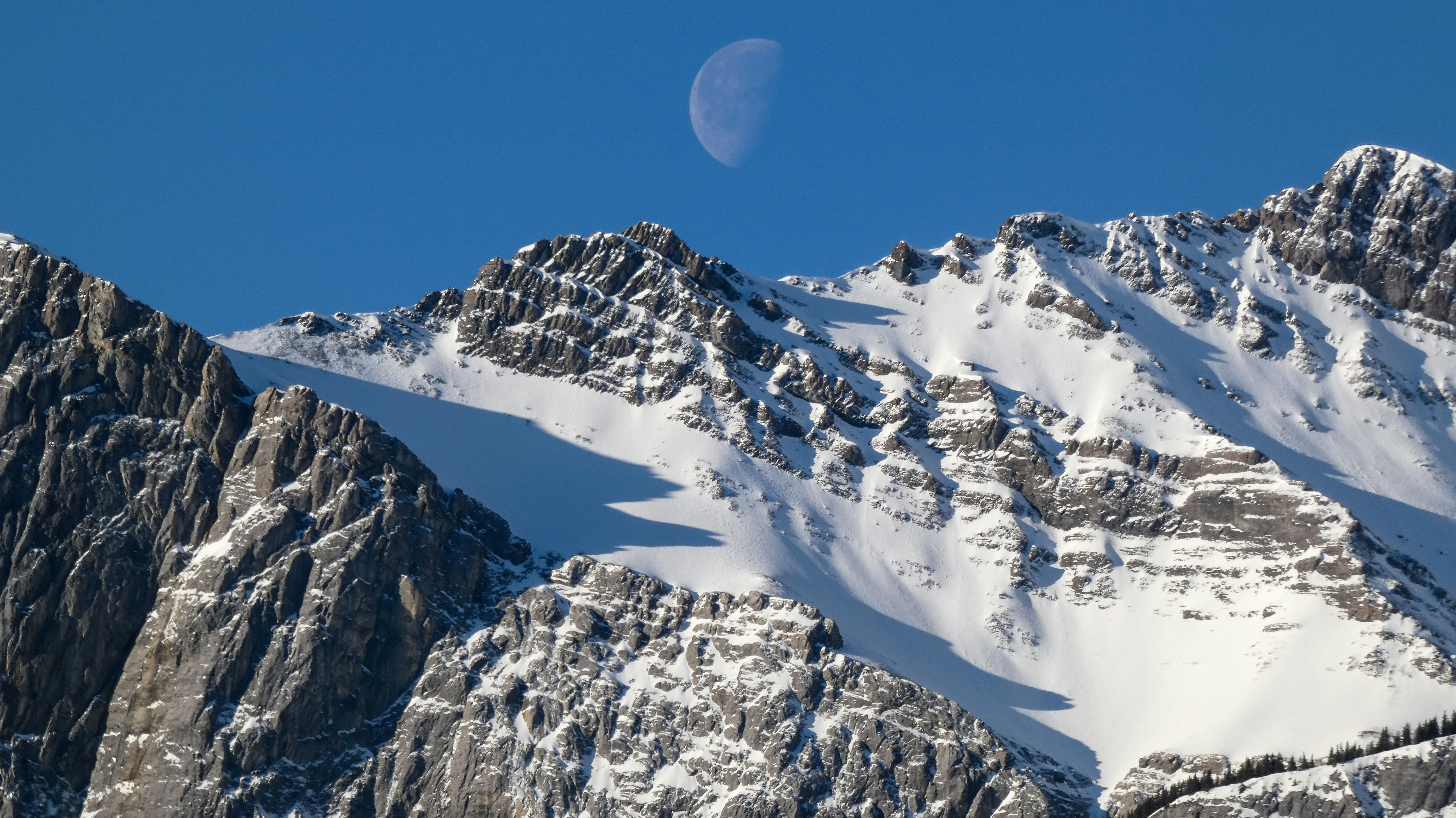 snow covered mountain during daytime